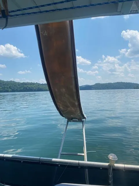 Slide: The Image of Houseboat slide extending over calm lake under blue sky, Jamestowner 16x72, 1992 model. - 29