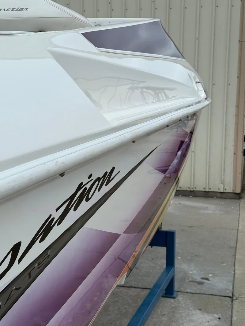 Slide: The Image of 2003 Sunsation 288 boat with sleek design and vibrant graphics on display. - 15