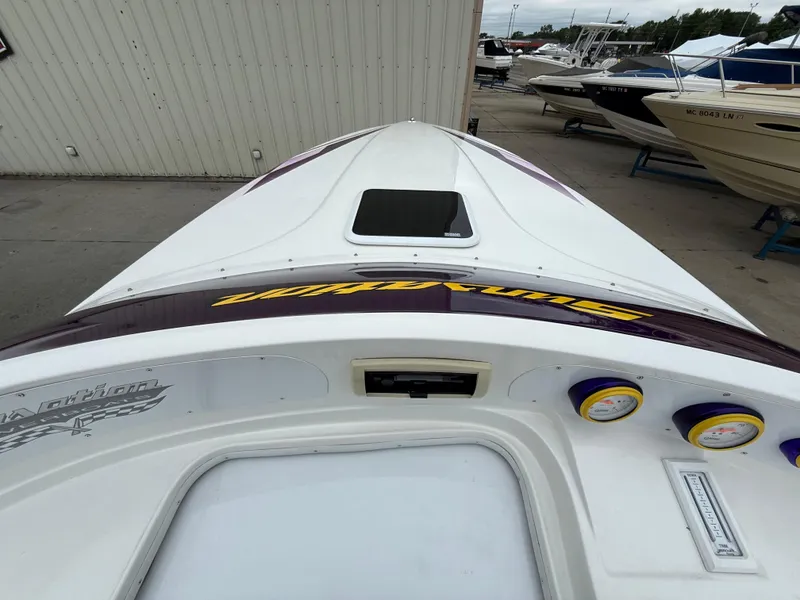 Slide: The Image of 2003 Sunsation 288 boat with sleek design and vibrant dashboard gauges. - 17