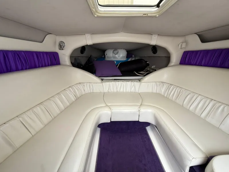 Slide: The Image of Interior of 2003 Sunsation 288 boat with white and purple seating. - 30