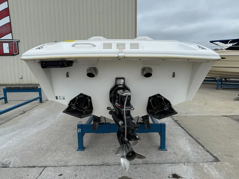 Slide: The Image of Rear view of a 2003 Sunsation 288 boat on a stand, showcasing the propeller and stern. - 5