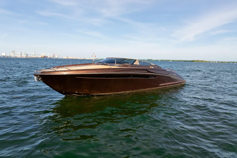 Slide: The Image of Luxurious 2005 Riva 44' Rivarama yacht cruising on open water. - 10
