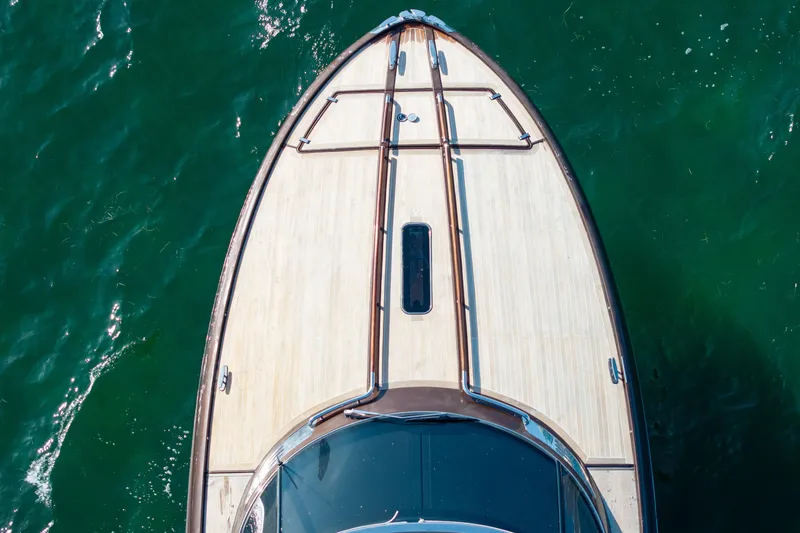 Slide: The Image of Top view of a 2005 Riva 44' Rivarama yacht on green water. - 12