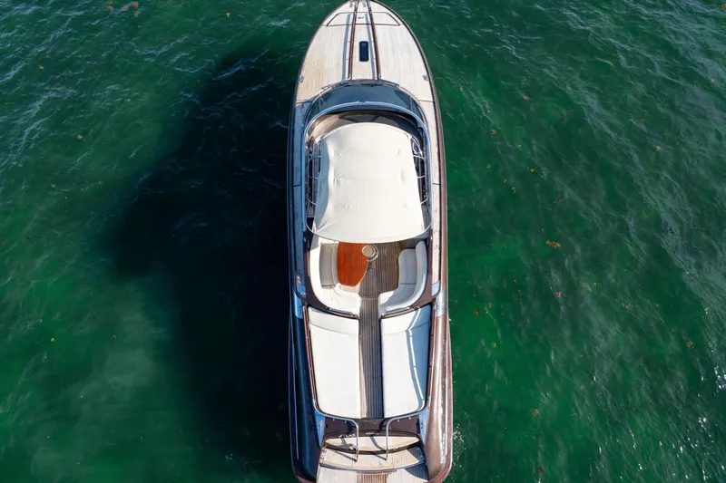 Slide: The Image of Aerial view of 2005 Riva 44' Rivarama yacht on clear green water. - 14