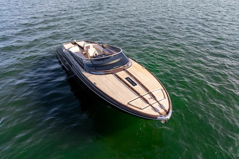 Slide: The Image of Luxurious 2005 Riva 44' Rivarama yacht on calm green waters. - 15