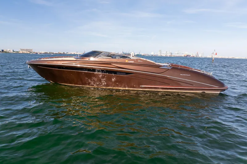 Slide: The Image of 2005 Riva 44' Rivarama luxury yacht cruising on open water. - 17