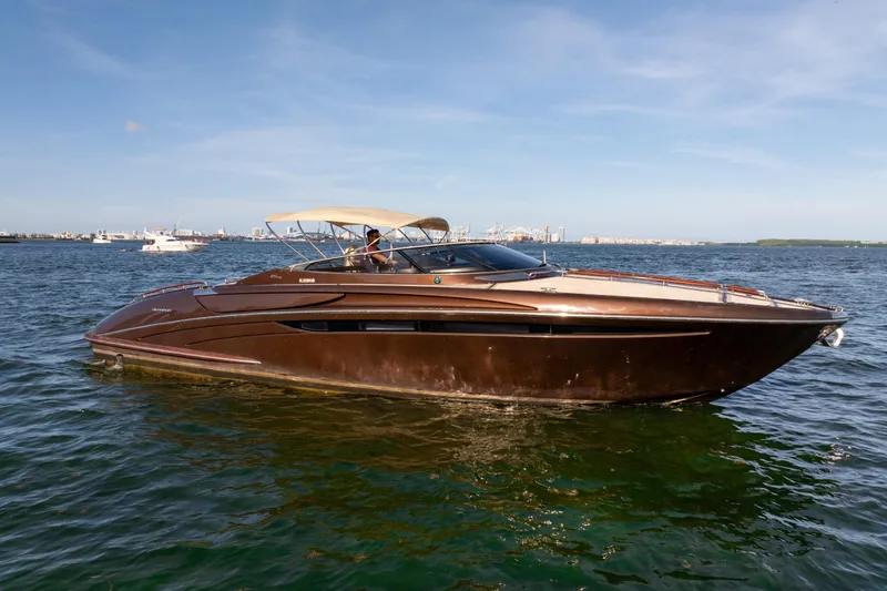 Slide: The Image of 2005 Riva 44' Rivarama luxury yacht cruising on open water. - 2