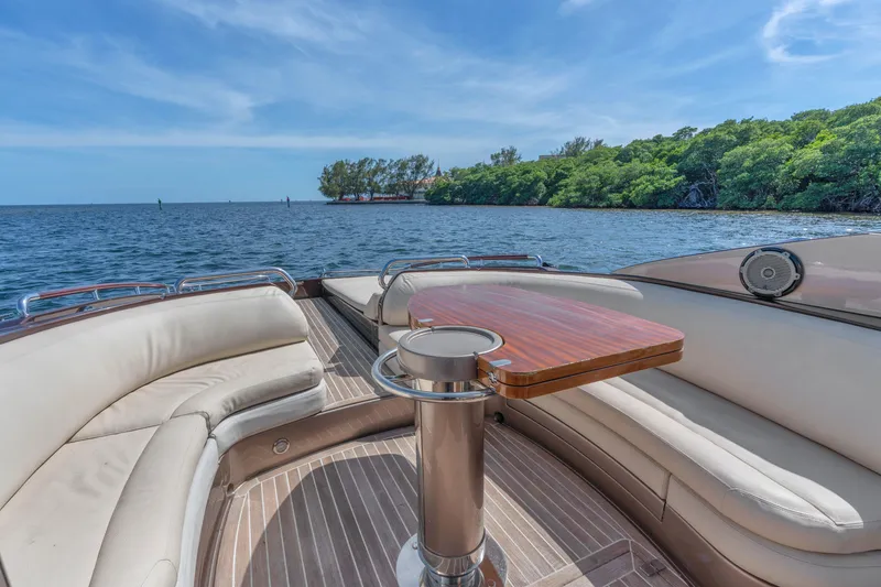 Slide: The Image of Luxurious 2005 Riva 44' Rivarama yacht interior with elegant seating and scenic ocean view. - 23