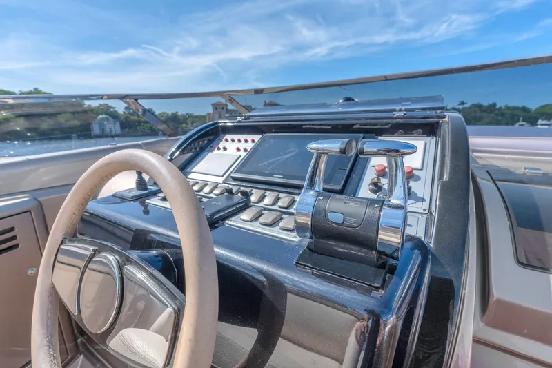 Slide: The Image of Cockpit of 2005 Riva 44' Rivarama yacht with steering wheel and controls. - 26