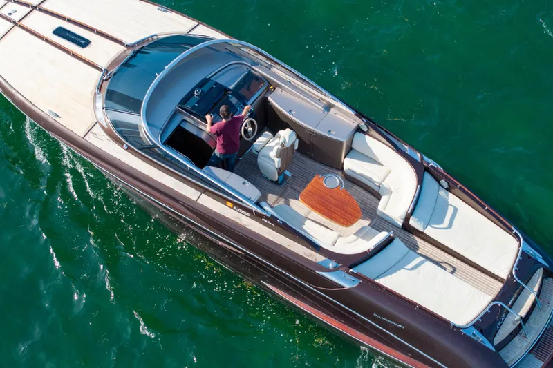 Slide: The Image of Overhead view of a 2005 Riva 44' Rivarama luxury yacht on water. - 3