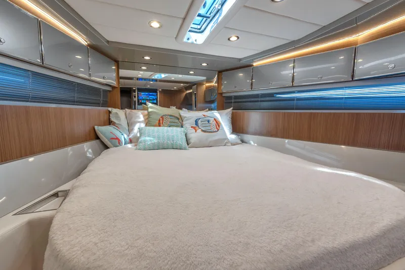 Slide: The Image of Luxurious interior of 2005 Riva 44' Rivarama yacht with cozy bedding and modern design. - 31