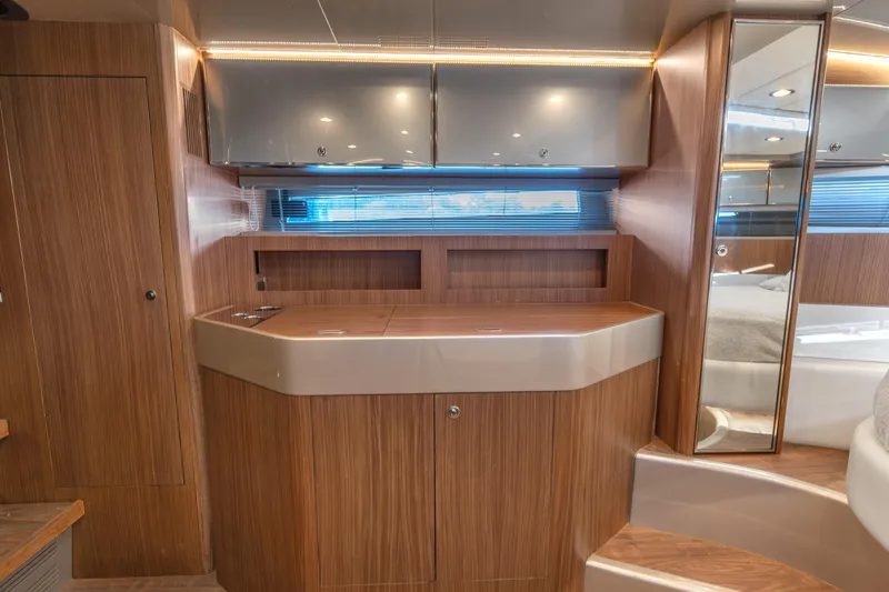 Slide: The Image of Luxurious interior of 2005 Riva 44' Rivarama yacht with wood cabinetry and modern design. - 34