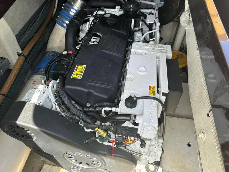 Slide: The Image of Engine compartment of a 2005 Riva Rivarama boat, showcasing detailed mechanical components. - 35