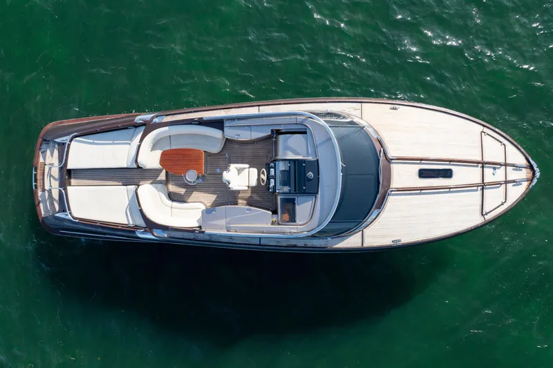 Slide: The Image of Overhead view of a 2005 Riva 44' Rivarama luxury yacht on water. - 5