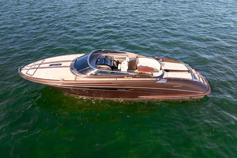 Slide: The Image of 2005 Riva 44' Rivarama luxury yacht on open water, showcasing sleek design. - 6