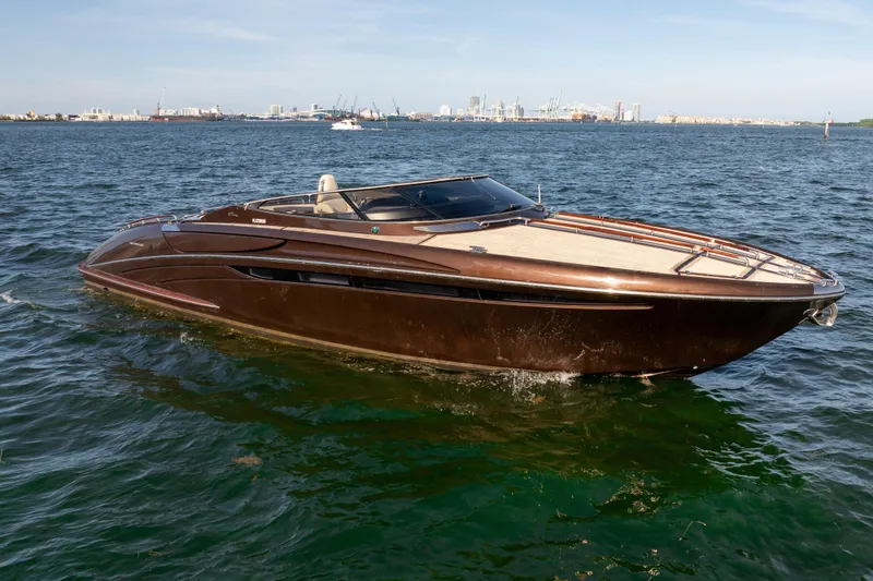 Slide: The Image of 2005 Riva 44' Rivarama luxury yacht cruising on open water. - 7