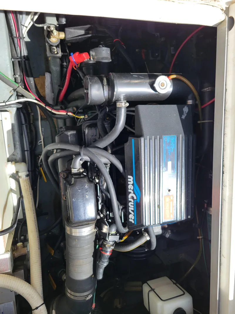 Slide: The Image of Engine compartment of a 1992 Sea Ray 330 Sundancer with MerCruiser components. - 15