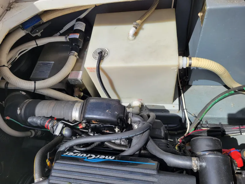Slide: The Image of Engine compartment of a 1992 Sea Ray 330 Sundancer with visible MerCruiser components. - 16
