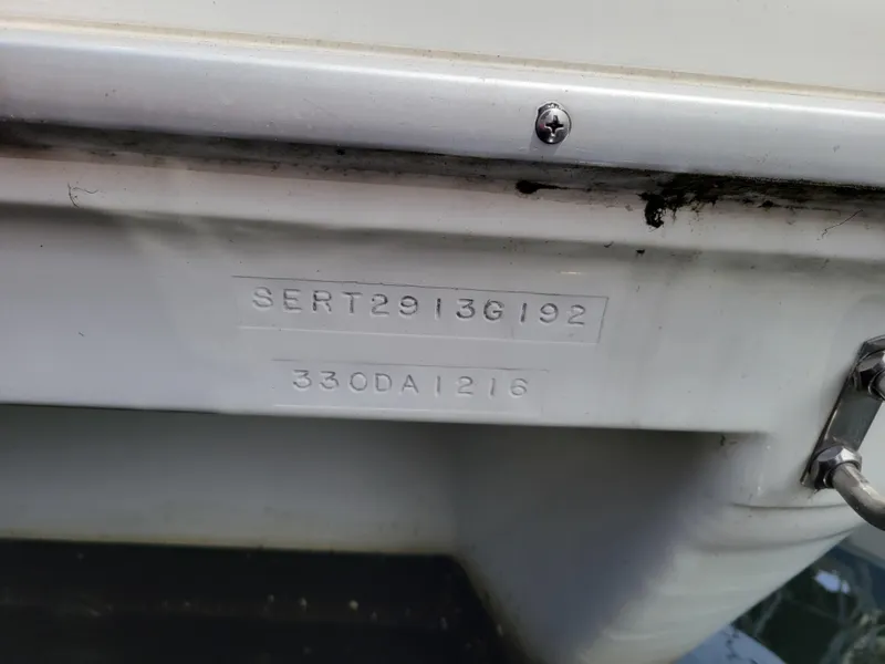 Slide: The Image of 1992 Sea Ray 330 Sundancer boat hull identification number (HIN) close-up. - 19