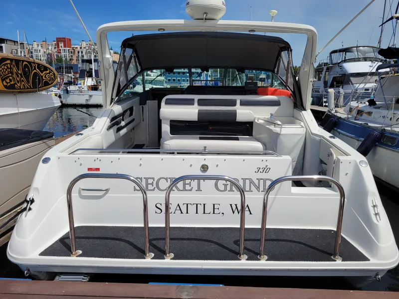 Slide: The Image of 1992 Sea Ray 330 Sundancer docked in Seattle marina, rear view. - 5