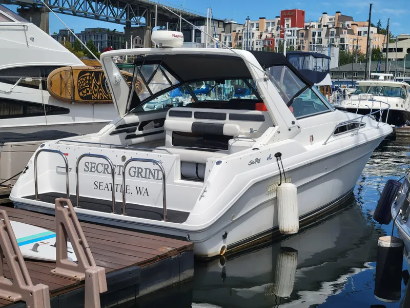 Slide: The Image of 1992 Sea Ray 330 Sundancer docked in Seattle marina, featuring sleek design and modern amenities. - 6