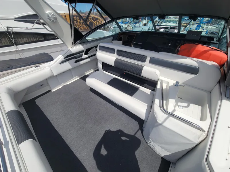 Slide: The Image of 1992 Sea Ray 330 Sundancer boat interior with spacious seating and modern design. - 8