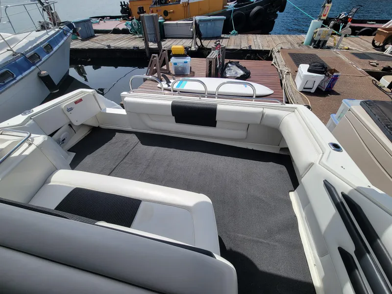 Slide: The Image of 1992 Sea Ray 330 Sundancer boat interior with seating, docked at marina. - 9
