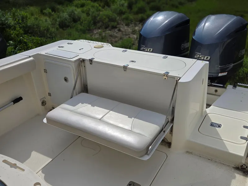 Slide: The Image of 2014 Pursuit C 280 Center Console boat with Yamaha 250 engines and foldable seating. - 11