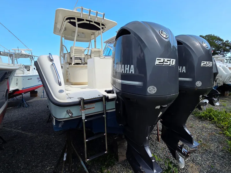 Slide: The Image of 2014 Pursuit C 280 Center Console boat with twin Yamaha 250 engines. - 2