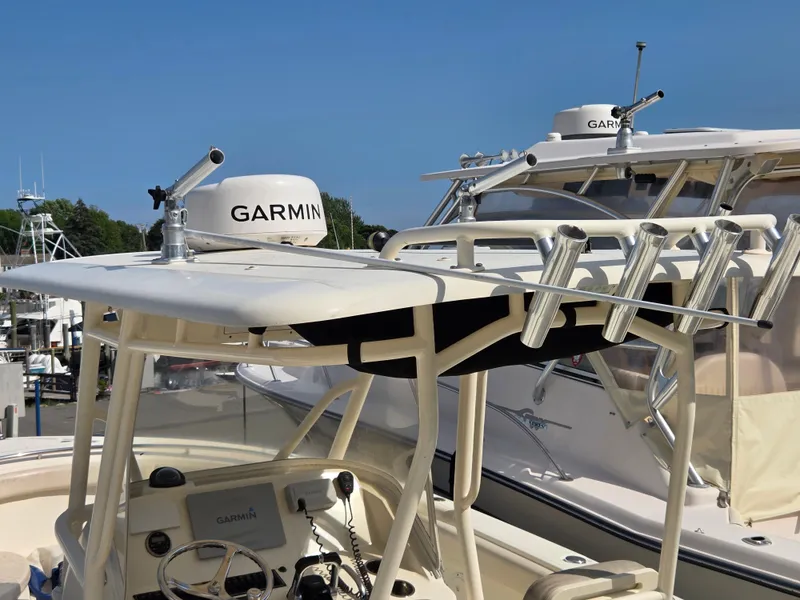 Slide: The Image of 2014 Pursuit C 280 Center Console boat with Garmin radar and rod holders. - 4