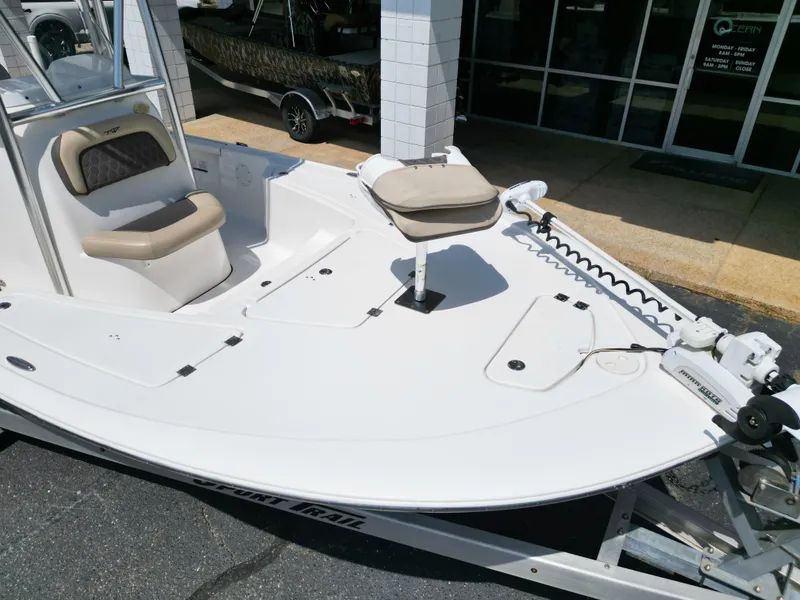 Slide: The Image of 2018 Tidewater 2110 Baymax boat with seating and trolling motor on display. - 12