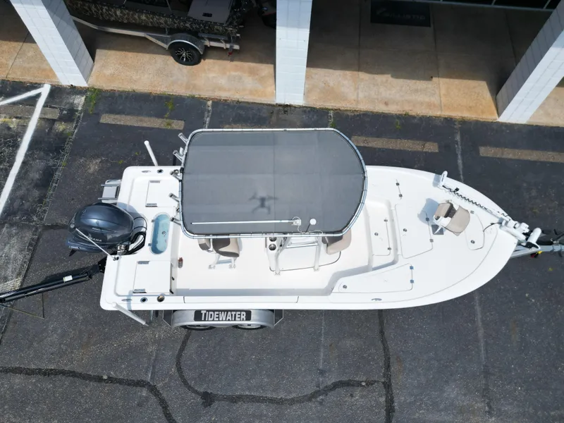 Slide: The Image of Overhead view of 2018 Tidewater 2110 Baymax boat with canopy and motor. - 17