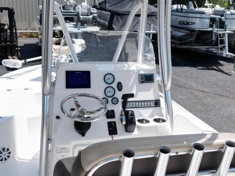 Slide: The Image of 2018 Tidewater 2110 Baymax boat console with steering wheel and gauges. - 9