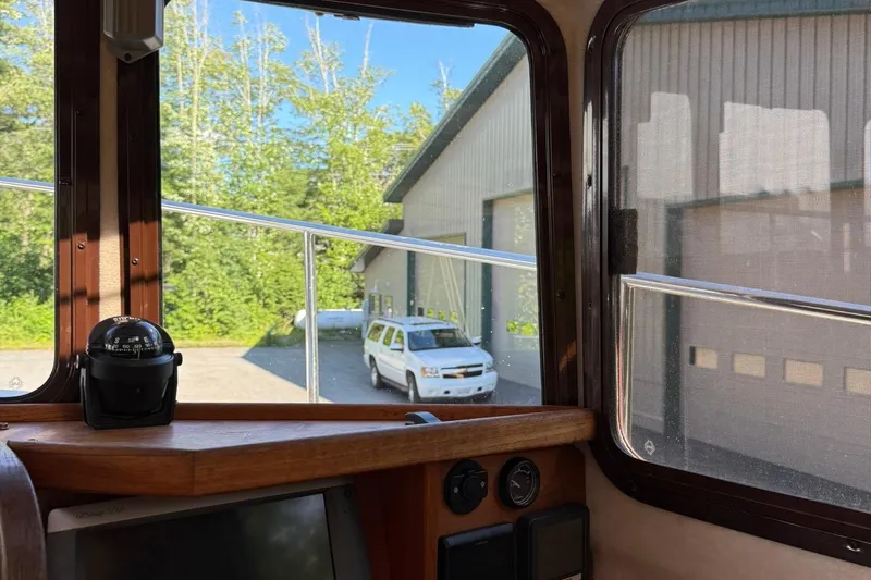 Slide: The Image of Interior view from 2010 Ranger Tugs R-25, showing compass and exterior building. - 31