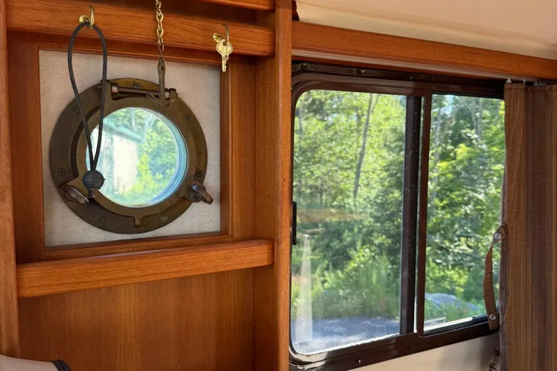 Slide: The Image of Interior of 2010 Ranger Tugs R-25 with porthole and window view. - 32