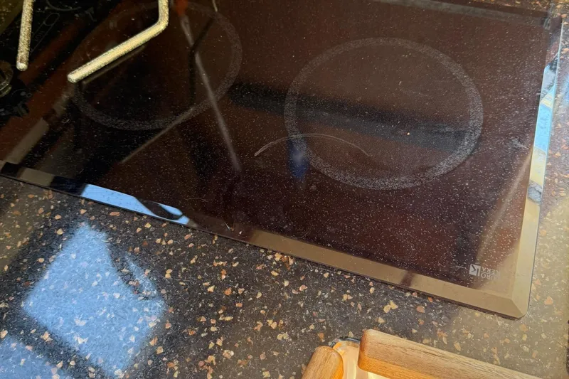 Slide: The Image of Glass cooktop on 2010 Ranger Tugs R-25 boat with speckled countertop. - 35