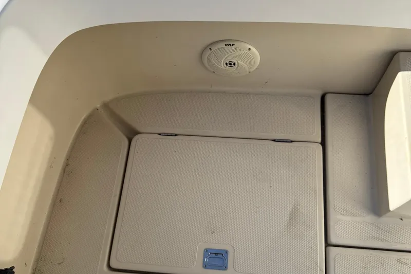 Slide: The Image of 2010 Ranger Tugs R-25 boat interior with speaker and storage compartment. - 45