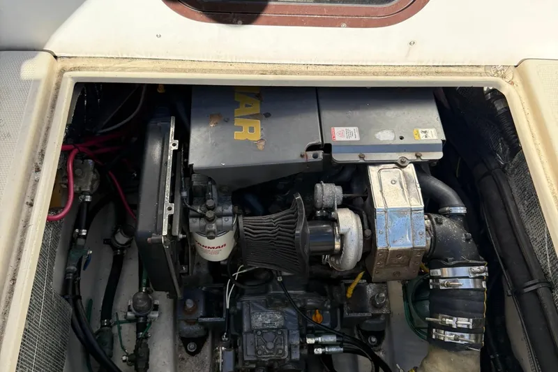 Slide: The Image of Engine compartment of a 2010 Ranger Tugs R-25 boat, featuring a Yanmar engine. - 47