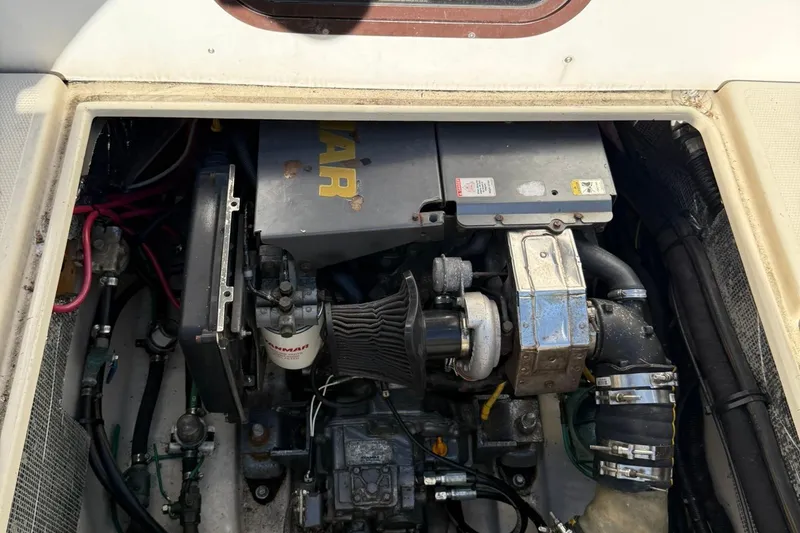 Slide: The Image of Engine compartment of a 2010 Ranger Tugs R-25 boat, featuring a Yanmar engine. - 48