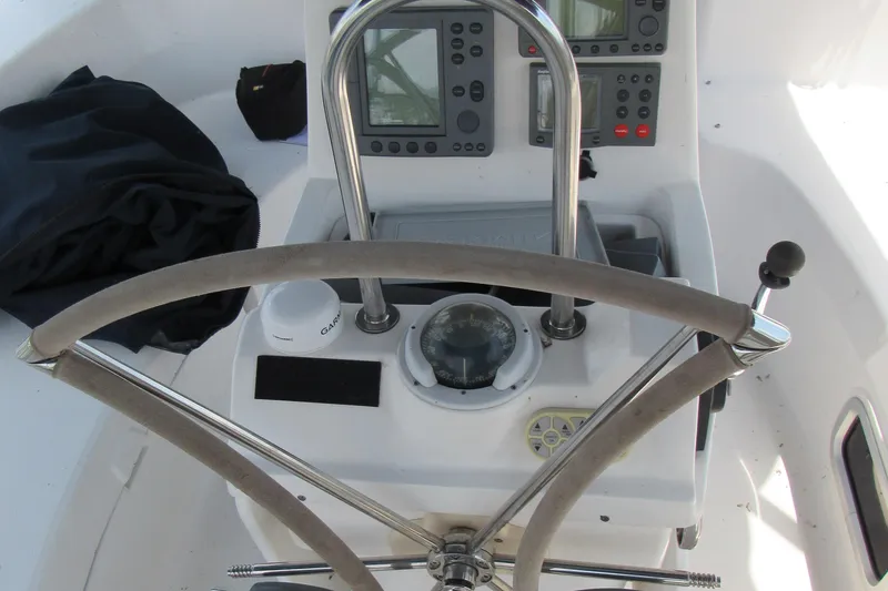 Slide: The Image of Steering console of a 2002 Hunter 466 sailboat with navigation instruments. - 29