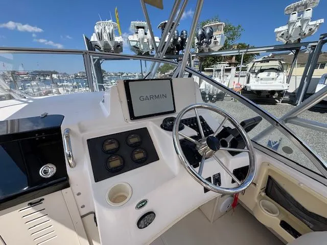 Slide: The Image of 2003 Grady-White Sailfish 282 boat cockpit with Garmin navigation system. - 12