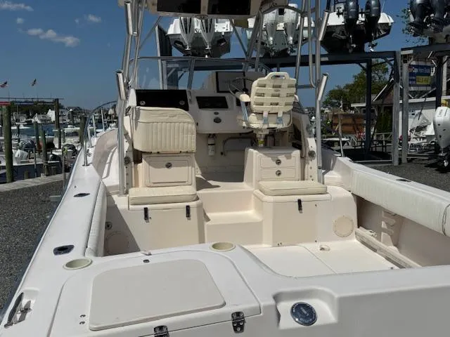 Slide: The Image of 2003 Grady-White Sailfish 282 boat interior with seating and control panel. - 7