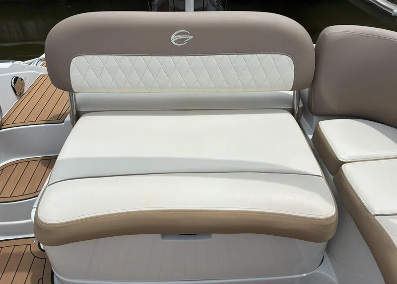 Slide: The Image of 2022 Crownline Eclipse E235 XS boat seating with beige and white upholstery. - 14