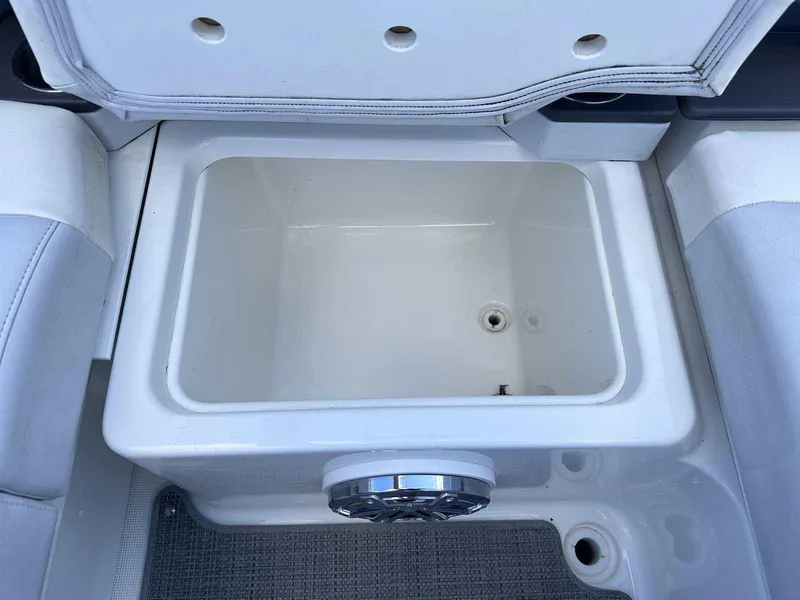Slide: The Image of 2016 Formula 240 Bowrider storage compartment with open lid, showcasing interior space. - 13