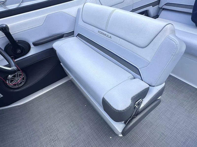 Slide: The Image of 2016 Formula 240 Bowrider interior seating with steering wheel and speaker. - 15