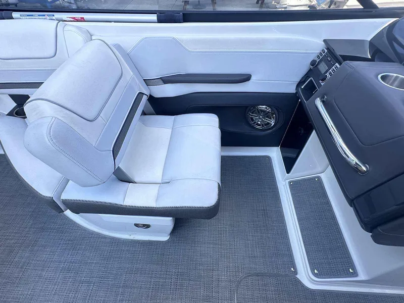 Slide: The Image of 2016 Formula 240 Bowrider interior with white seating and dashboard details. - 21