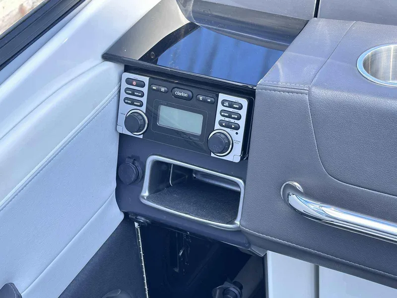 Slide: The Image of 2016 Formula 240 Bowrider dashboard with Clarion stereo system and cup holder. - 23