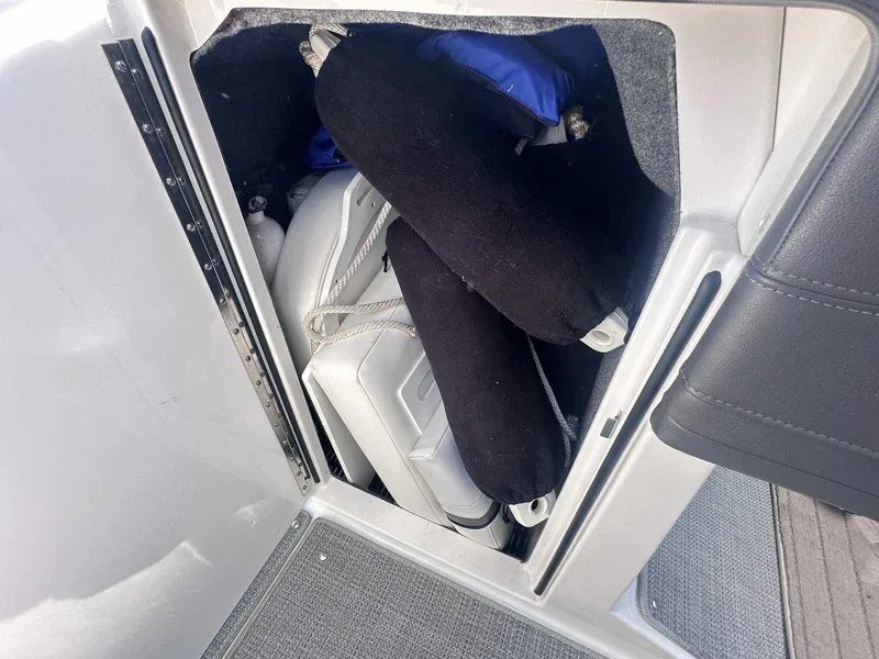 Slide: The Image of Storage compartment in a 2016 Formula 240 Bowrider boat with fenders and equipment. - 26