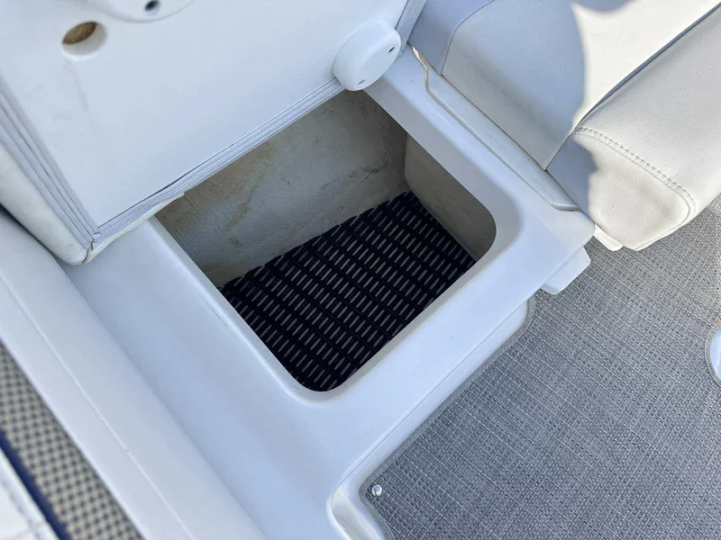 Slide: The Image of Storage compartment in 2016 Formula 240 Bowrider boat, featuring cushioned seating and non-slip flooring. - 29