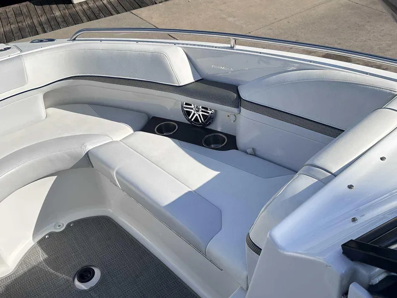 Slide: The Image of 2016 Formula 240 Bowrider interior with white seating and cup holders. - 30